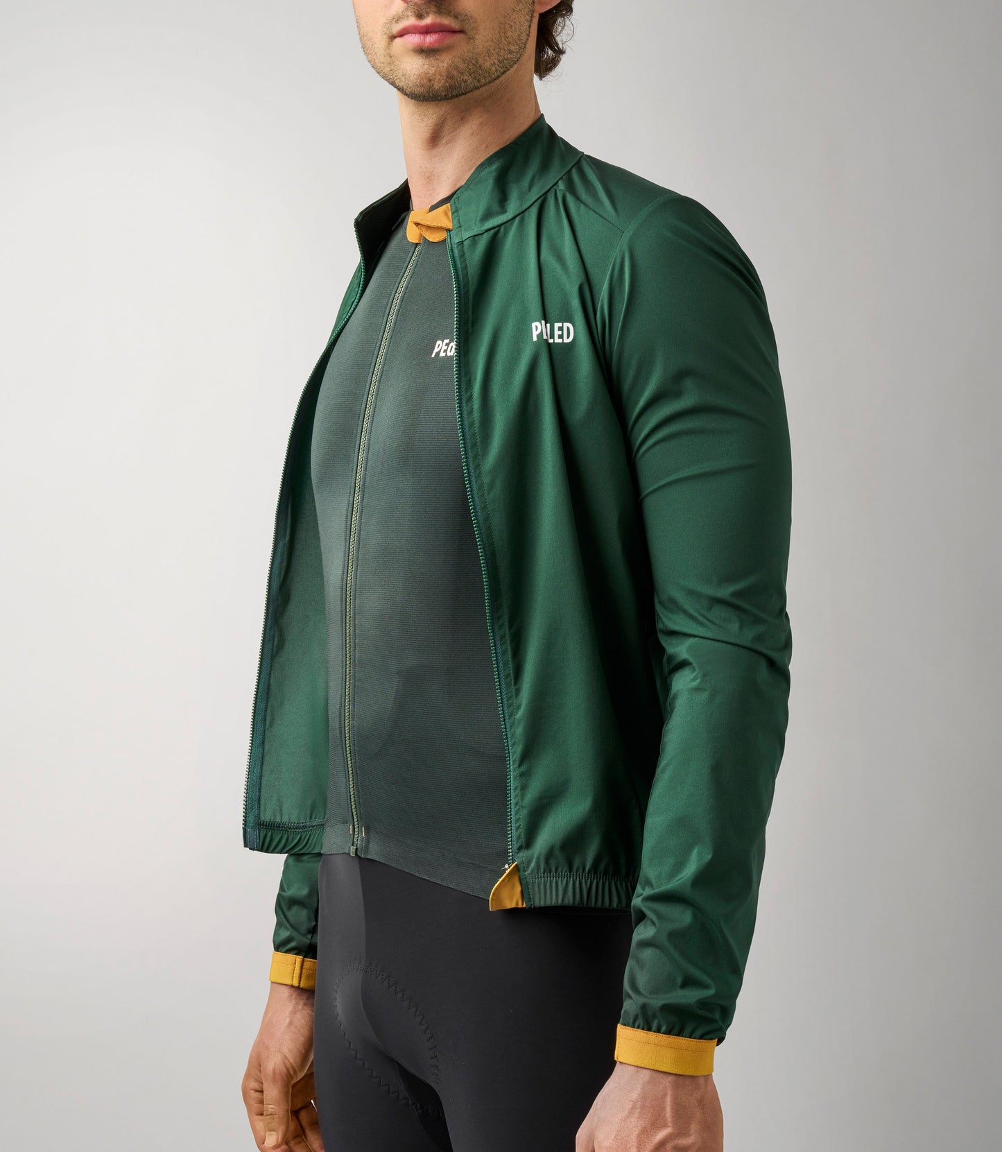 23SJKES78PE_8_windproof jacket men cycling green essential front open pedaled