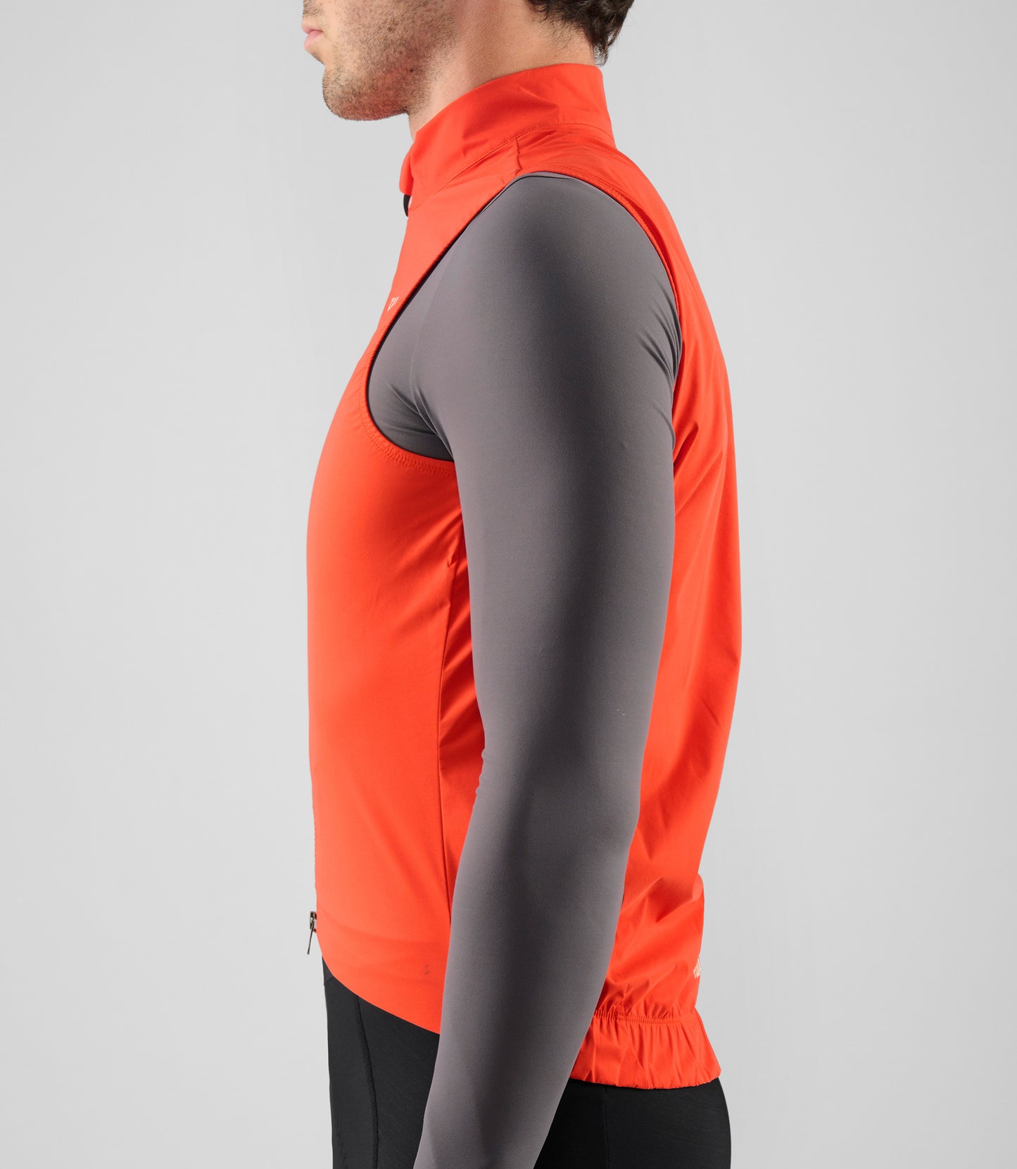 25WWVEL12PE_8_men cycling waterproof vest orange element side pedaled