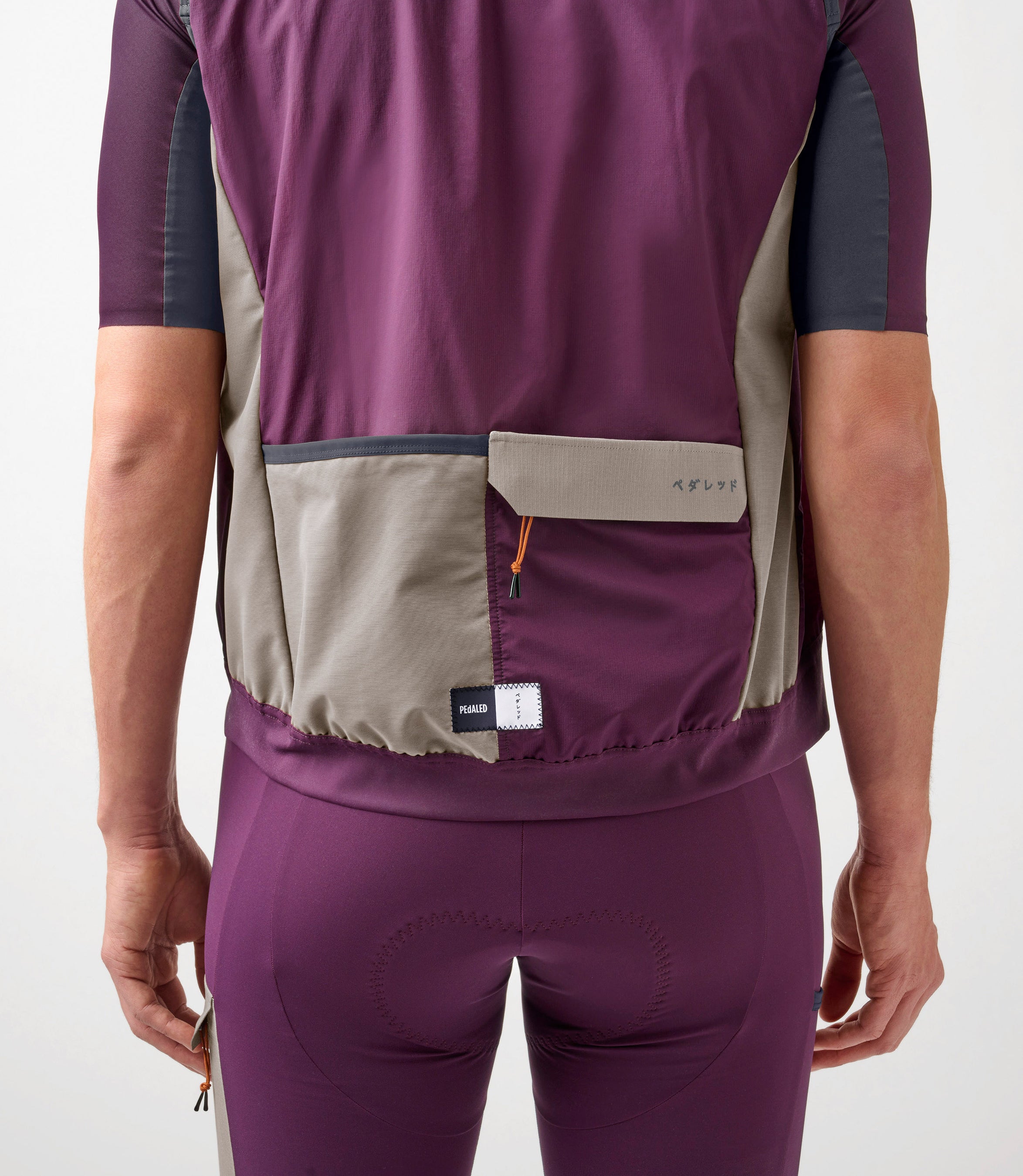 23SAVOD10PE_7_men cycling alpha vest purple odyssey back pocket pedaled