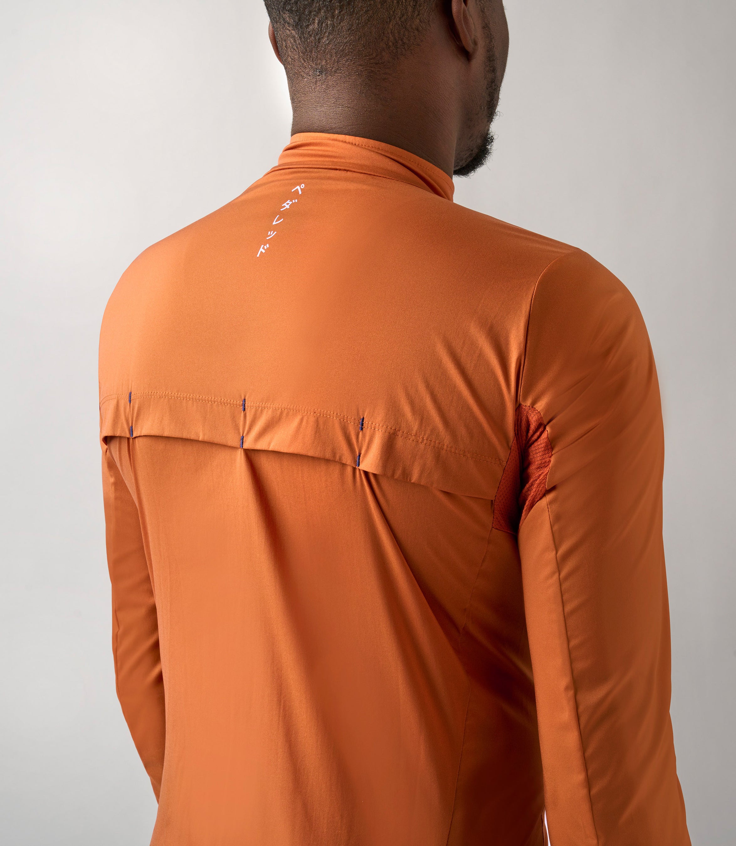 23SJKES0HPE_7_windproof jacket men cycling orange essential back pedaled