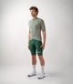 23SJSEM03PE_3_men cycling merino jersey green essential total body front pedaled