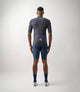 23SJSEM74PE_4_men cycling merino jersey navy essential total body back pedaled