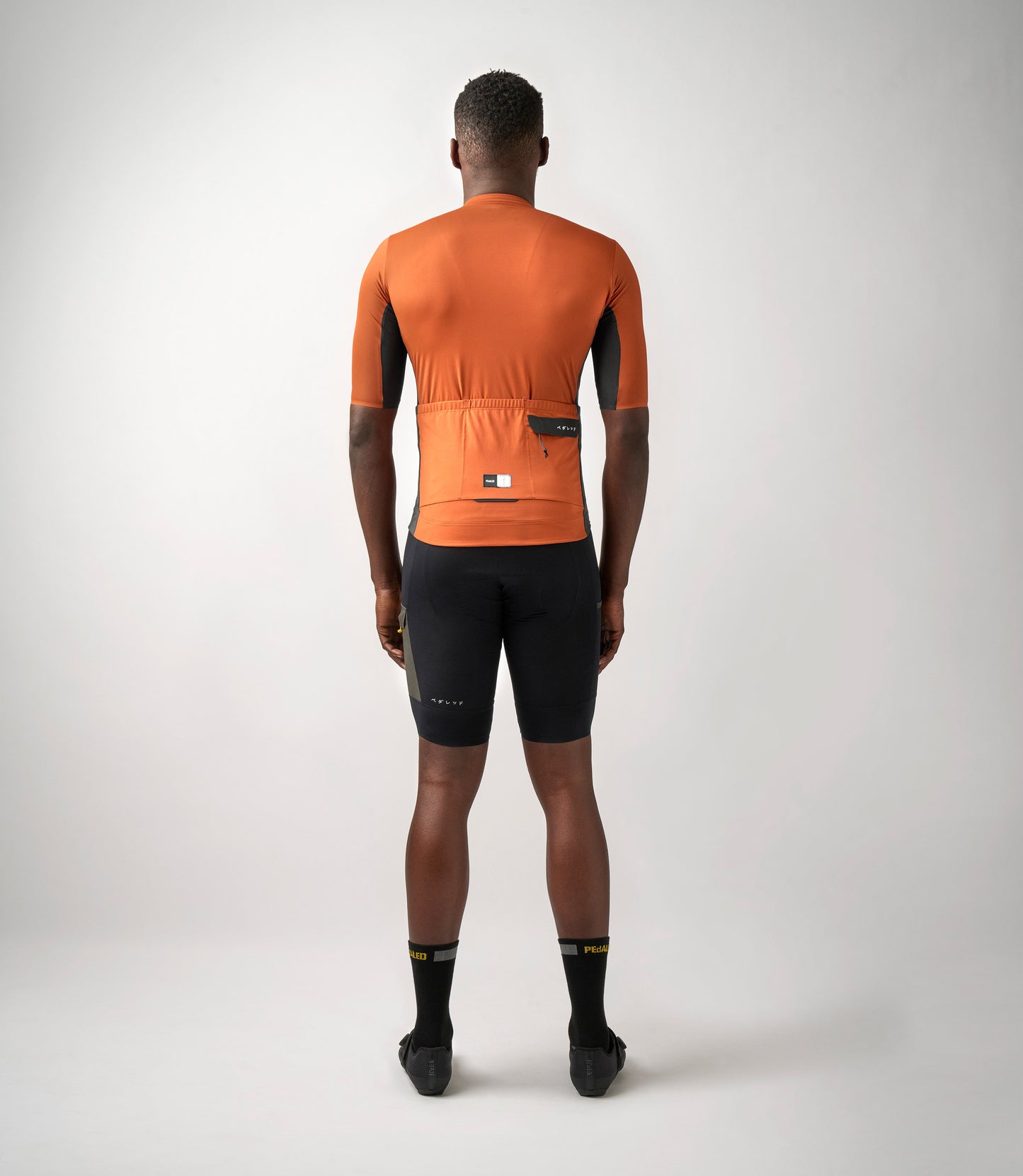 23SJSOD0HPE_4_men cycling cargo jersey orange odyssey total body back pedaled