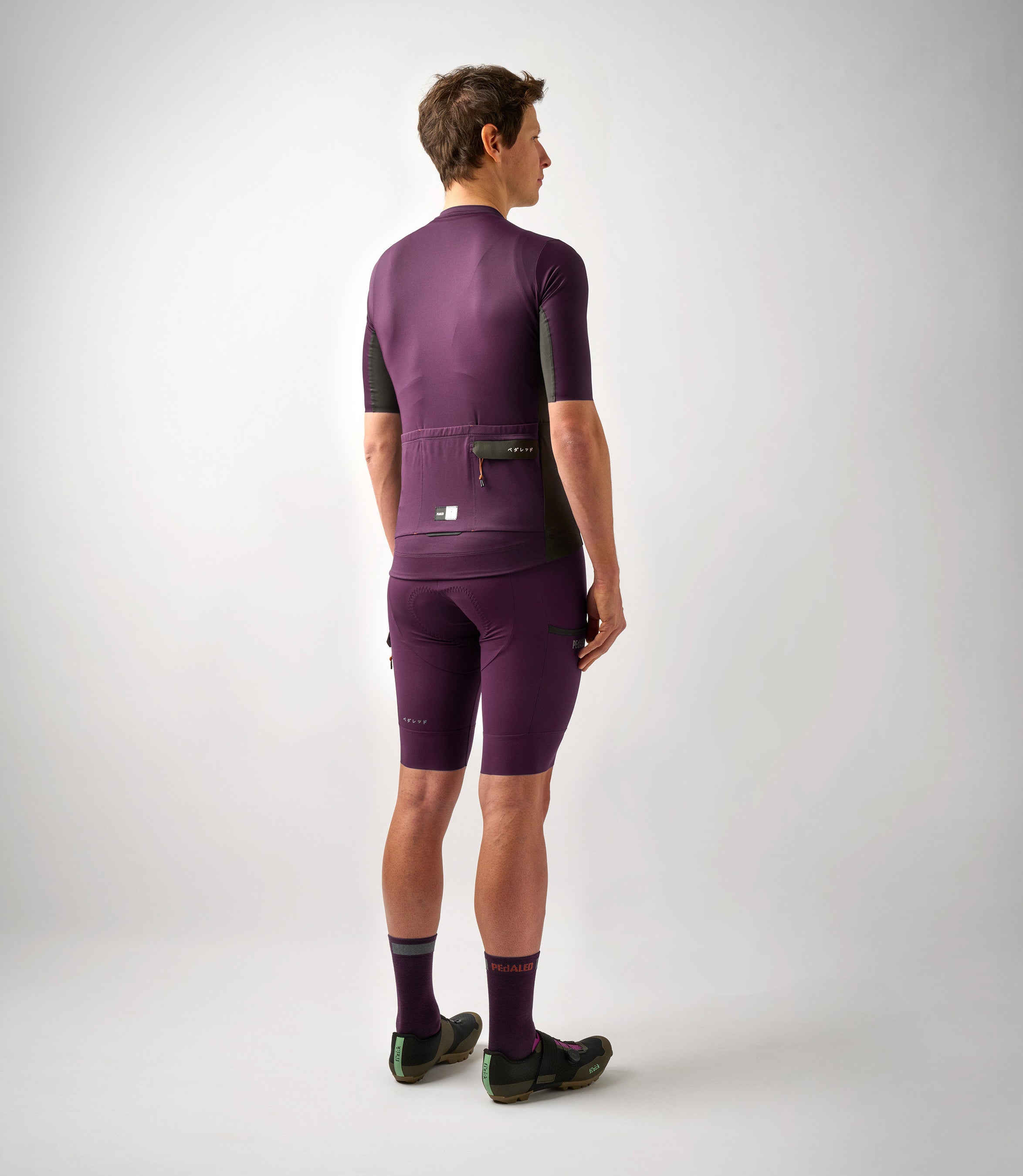 23SJSOD10PE_4_men cycling cargo jersey purple odyssey total body back pedaled
