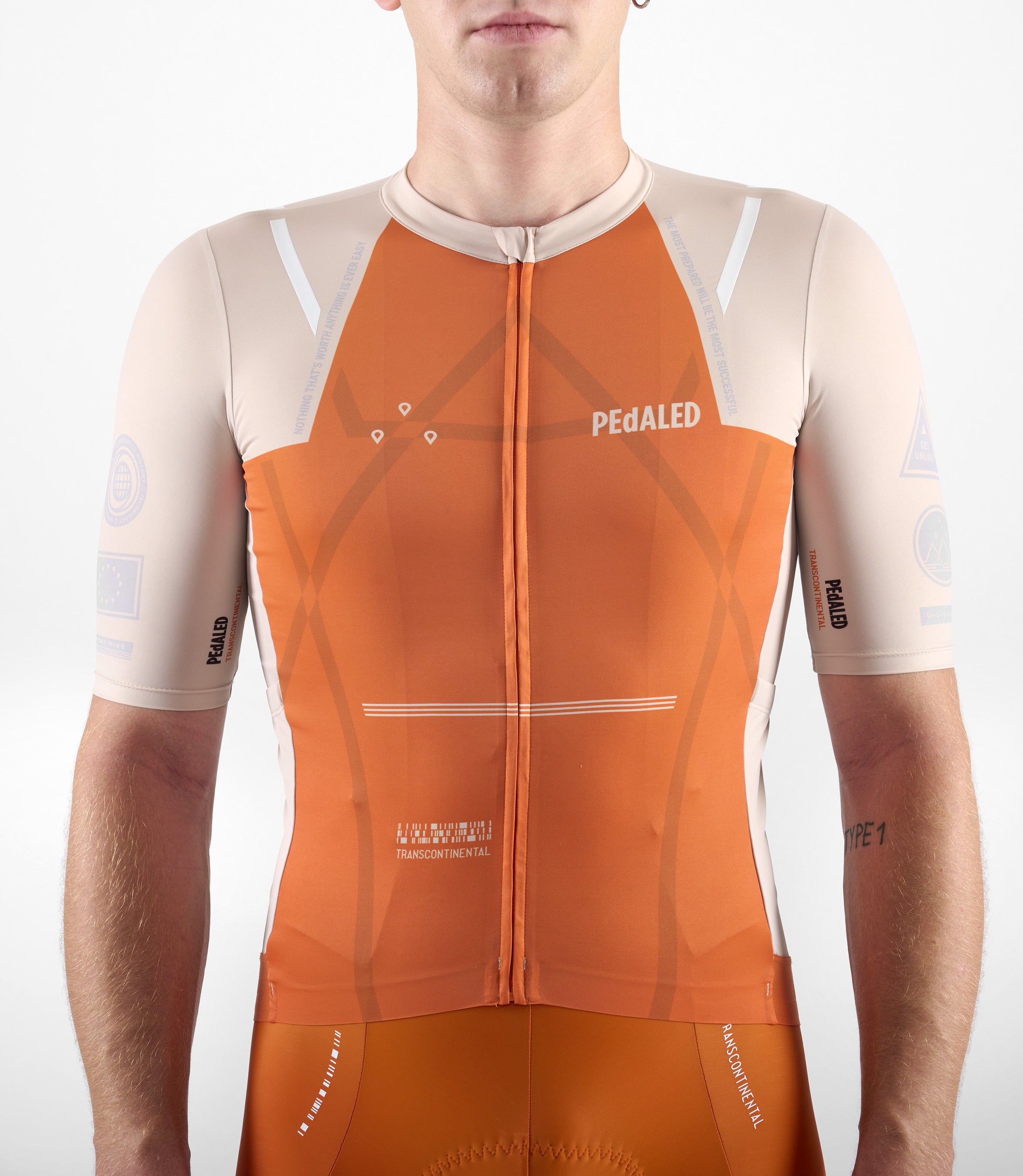 23SJSTC12PE_10_men cycling jersey transcontinental orange front pedaled