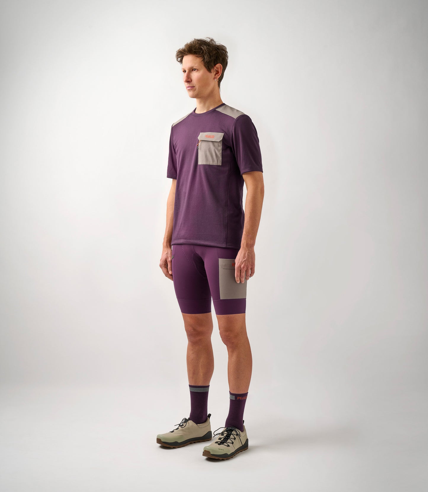 23SMTOD10PE_3_men cycling merino tee purple odyssey total body front pedaled