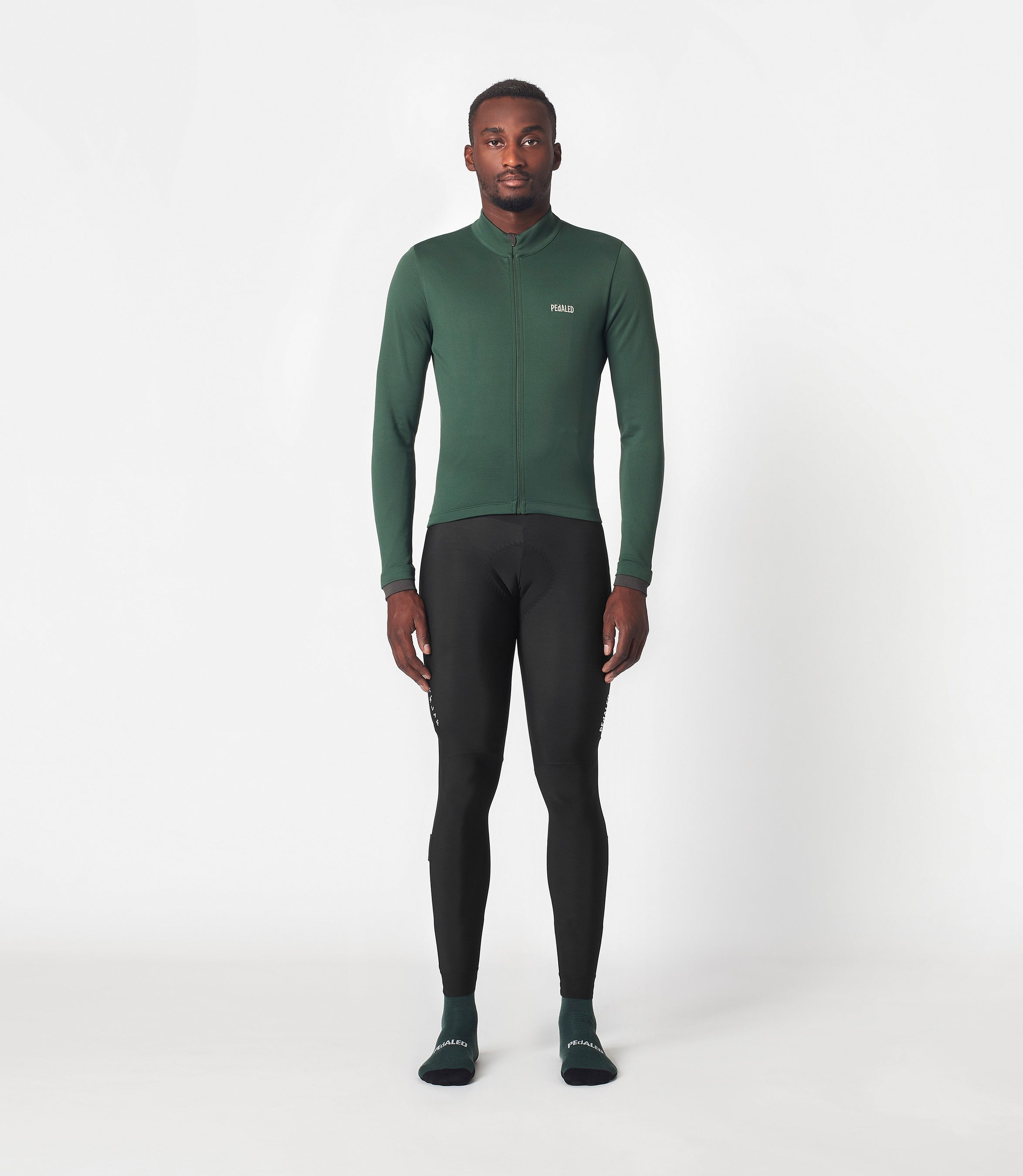 23WMJEM0APE_3_men cycling jersey merino long sleeve green essential total body front pedaled