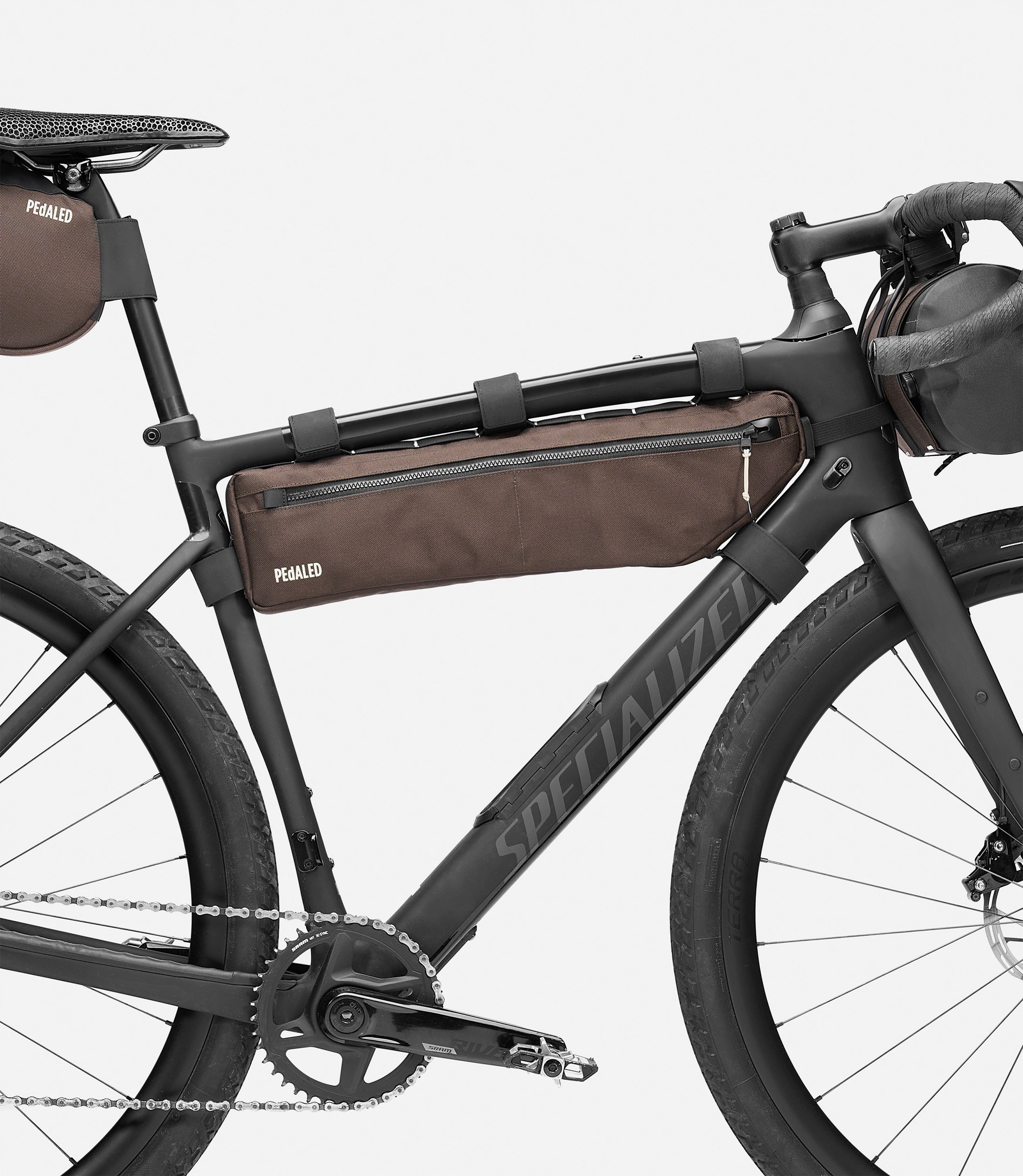 244FBOD14PE_3_bikepacking frame bag brown bike detail pedaled