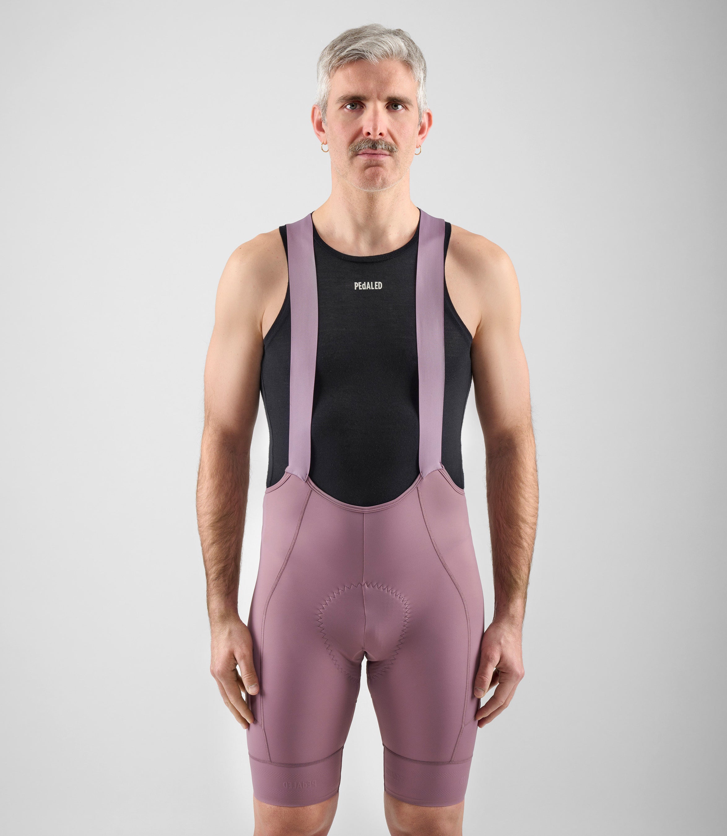 24SBBEL0IPE_3_men cycling bibshorts element lilac total body front pedaled