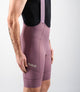 24SBBEL0IPE_5_men cycling bibshorts element lilac side pedaled