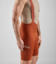 24SBBEL0QPE_5_men cycling bibshorts element brick red side pedaled