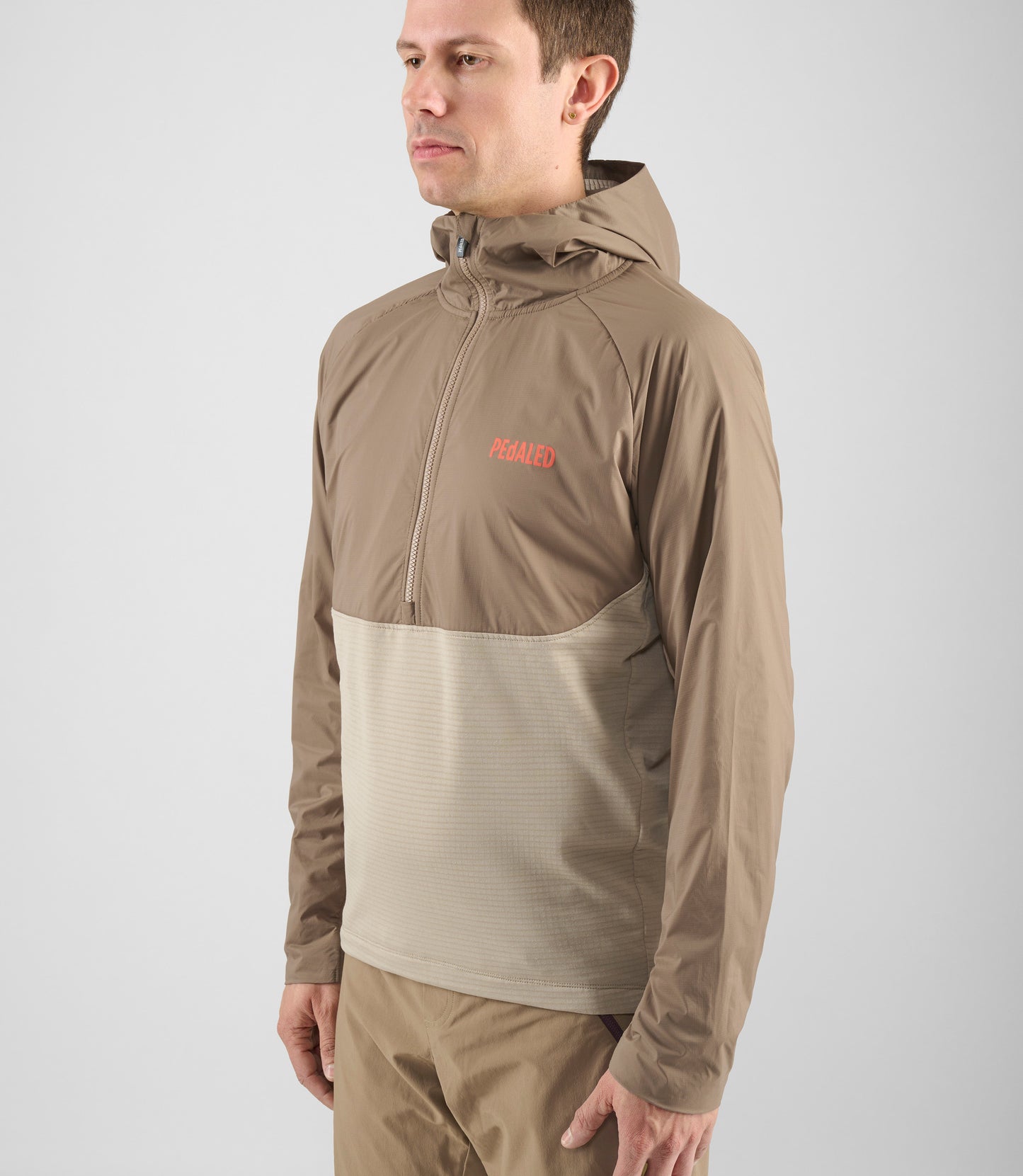 24SHAYA14PE_6_men cycling anorak hooded brown yama side detail pedaled