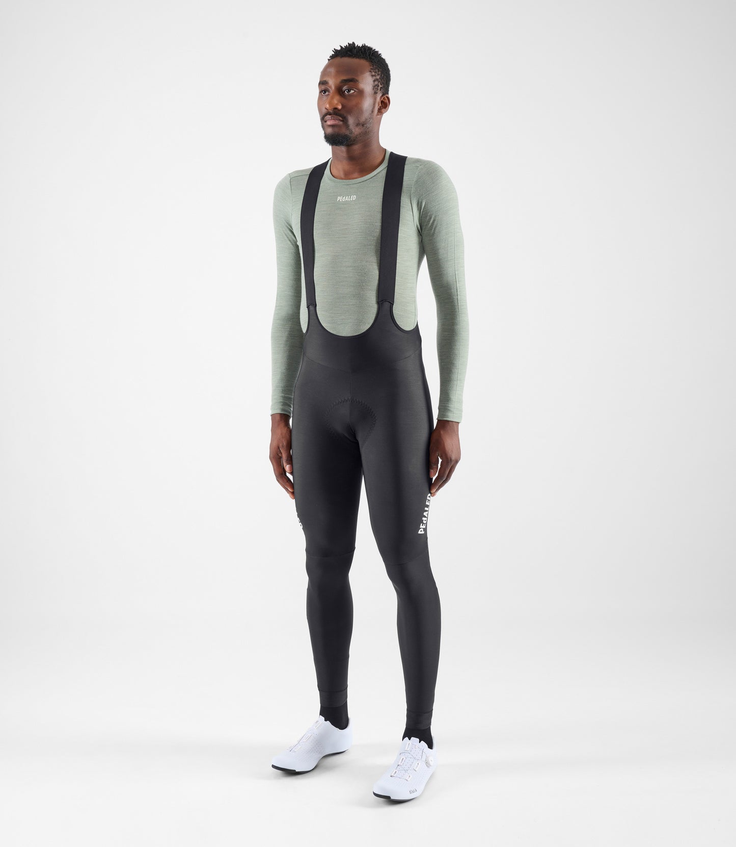 24WMBEL03PE_3_men cycling base layer green element total body front pedaled