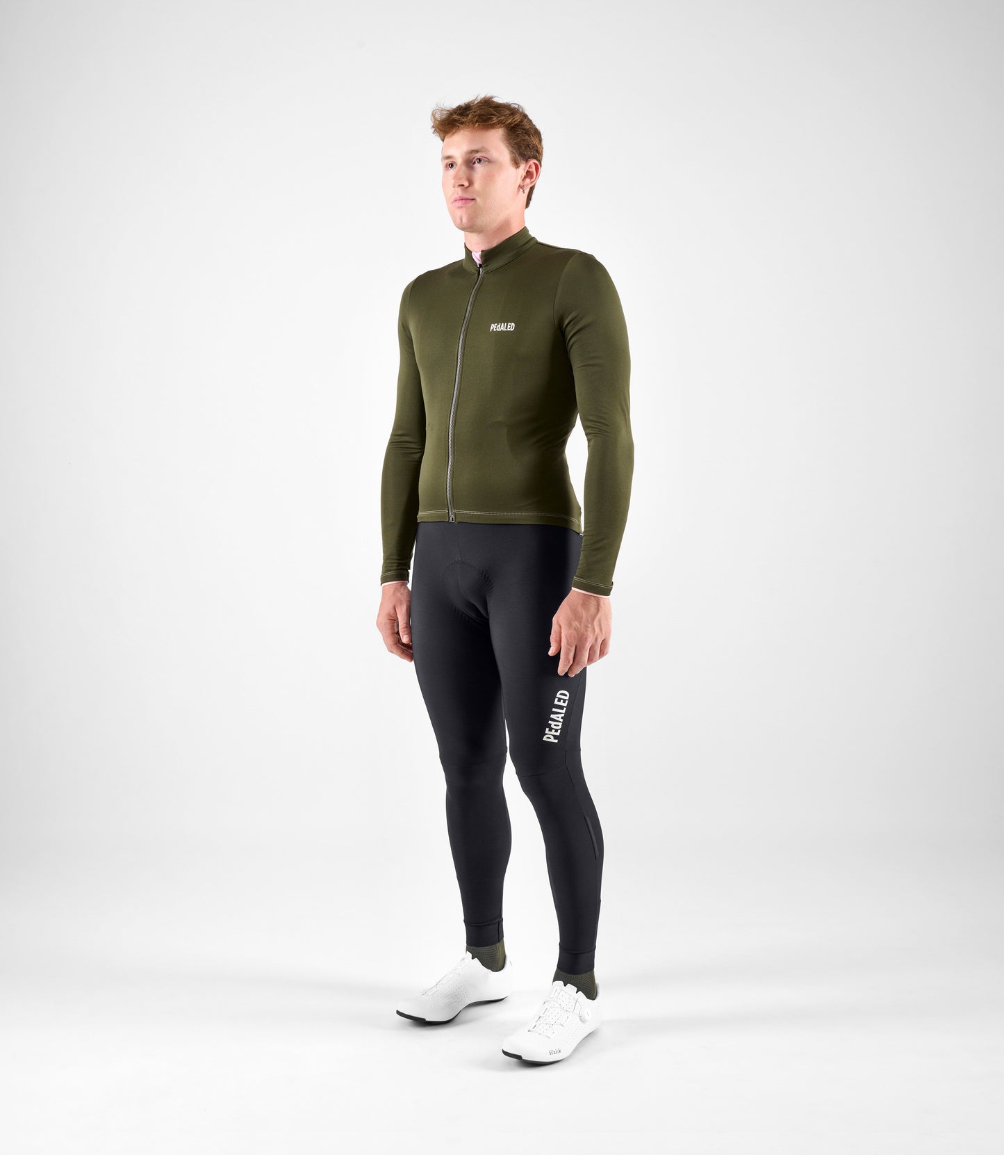 24WMJEL11PE_3_men cycling jersey merino long sleeve green element total body front pedaled