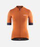 W3SJSES0HPE_1_women cycling jersey orange essential front pedaled