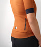 W3SJSES0HPE_5_cycling jersey women orange essential back pocket pedaled