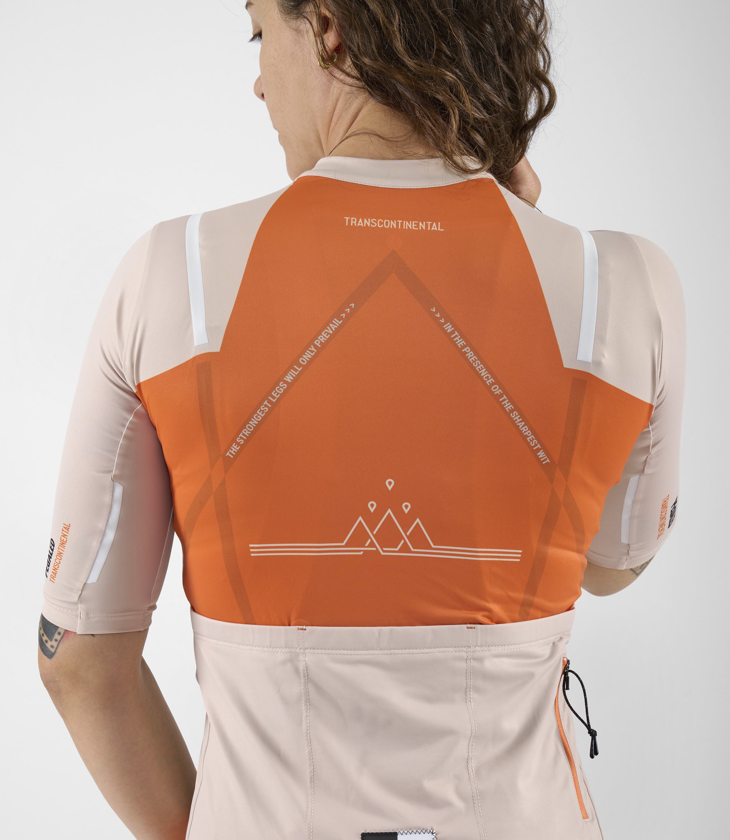 W3SJSTC12PE_10_women cycling jersey transcontinental orange back pedaled
