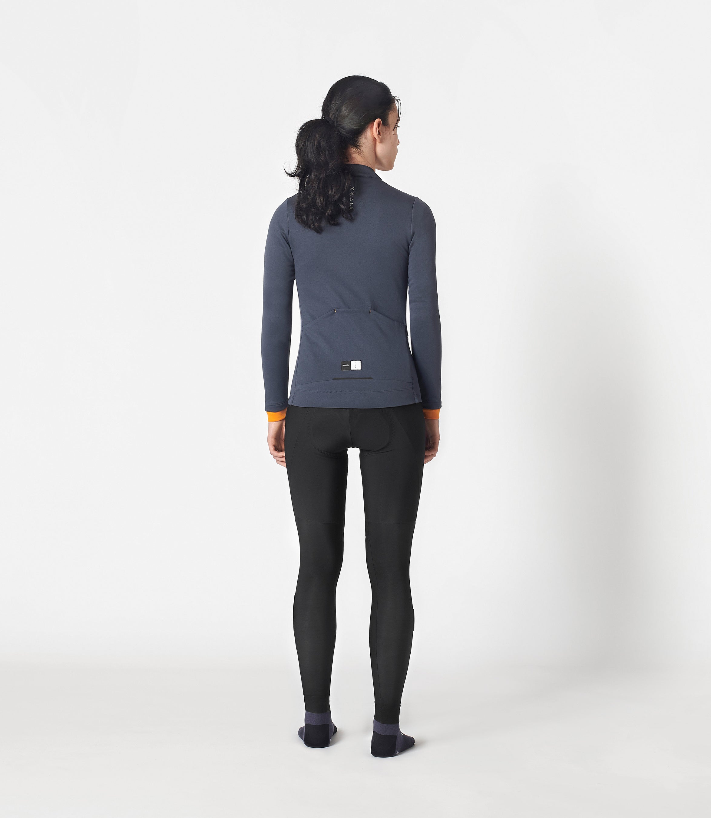 W3WMJEM0CPE_4_women cycling jersey merino long sleeve navy essential total body back pedaled