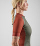 W4SJSEL52PE_5_cycling jersey women brick red element side left pedaled