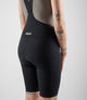 W4SLBEL00PE_7_women cycling lightweight bibshorts element black back pedaled